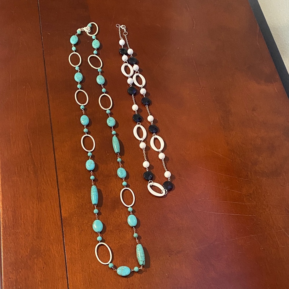 Two necklaces 
One is turquoise, the other is black and white.